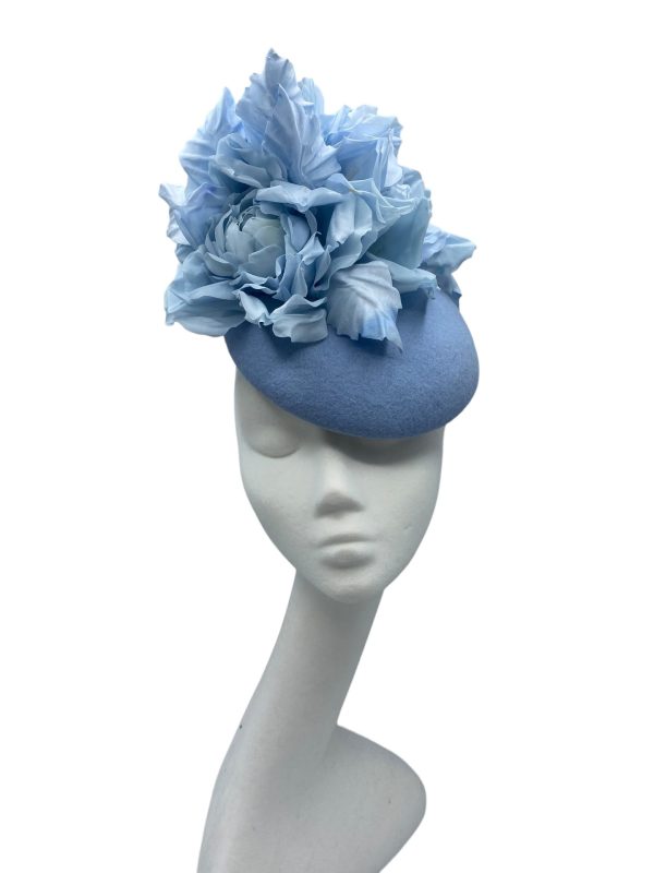 Stunning baby blue felt base headpiece with colour matching stunning handmade silk flowers.